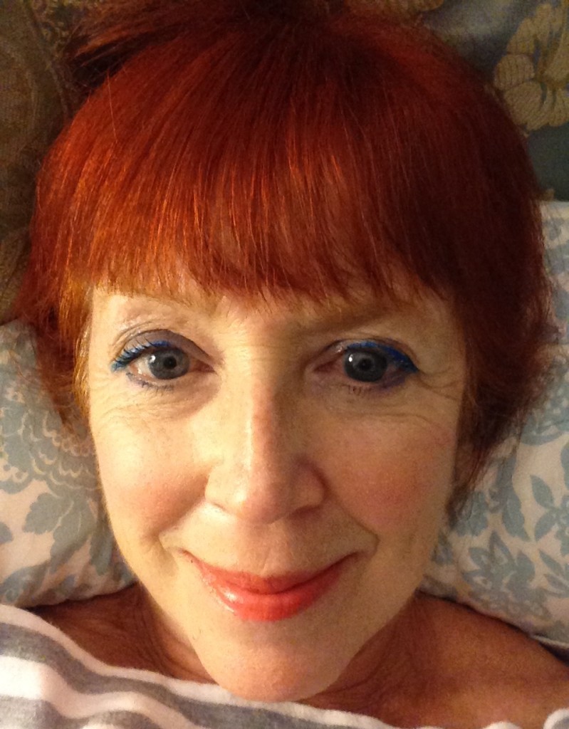 Face of the Day: blue eye makeup, tangerine blush and lipstick