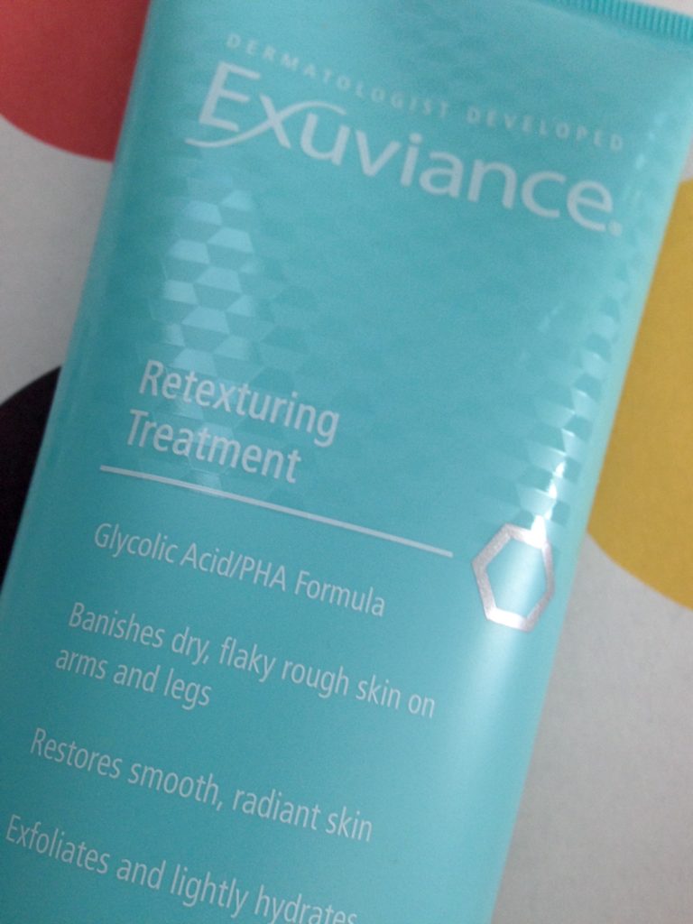 Exuviance Retexturing Treatment, closeup of benefits listed on tube neversaydiebeauty.com