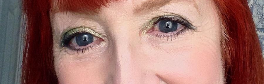 me wearing green eyeshadow & Celtics jacket for St. Patrick's Day neversaydiebeauty.com @redAllison