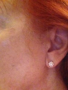 a sense of the size of Chloe+Isabel Daisy stud earrings, worn in my ear neversaydiebeauty.com