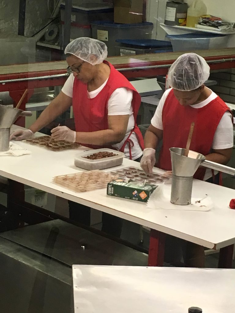 women making Harbor Sweets chocolates by hand
