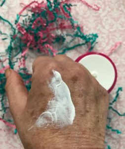 white StriVectin Repair and Protect Moisturizer spf 30 on my hand to show the color neversaydiebeauty.com