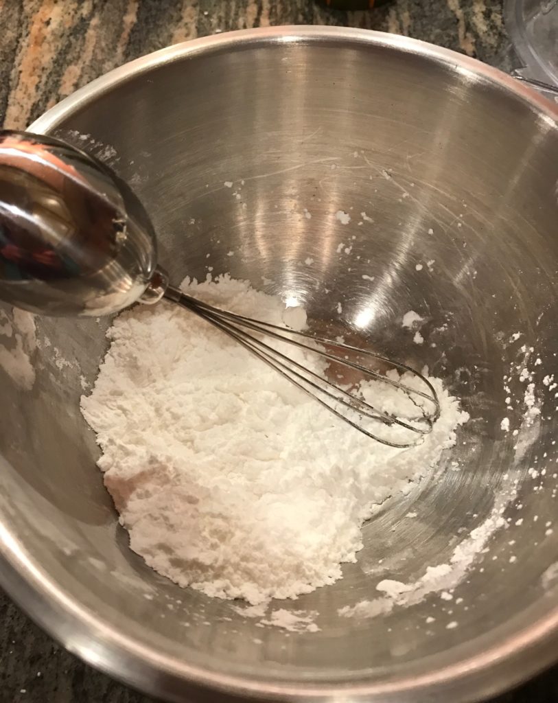 whisking together cornstarch and confectioner's sugar, neversaydiebeauty.com
