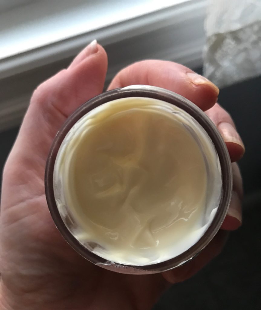 inside of a C.O. Bigelow Lemon Body Cream jar showing the cream, neversaydiebeauty.com