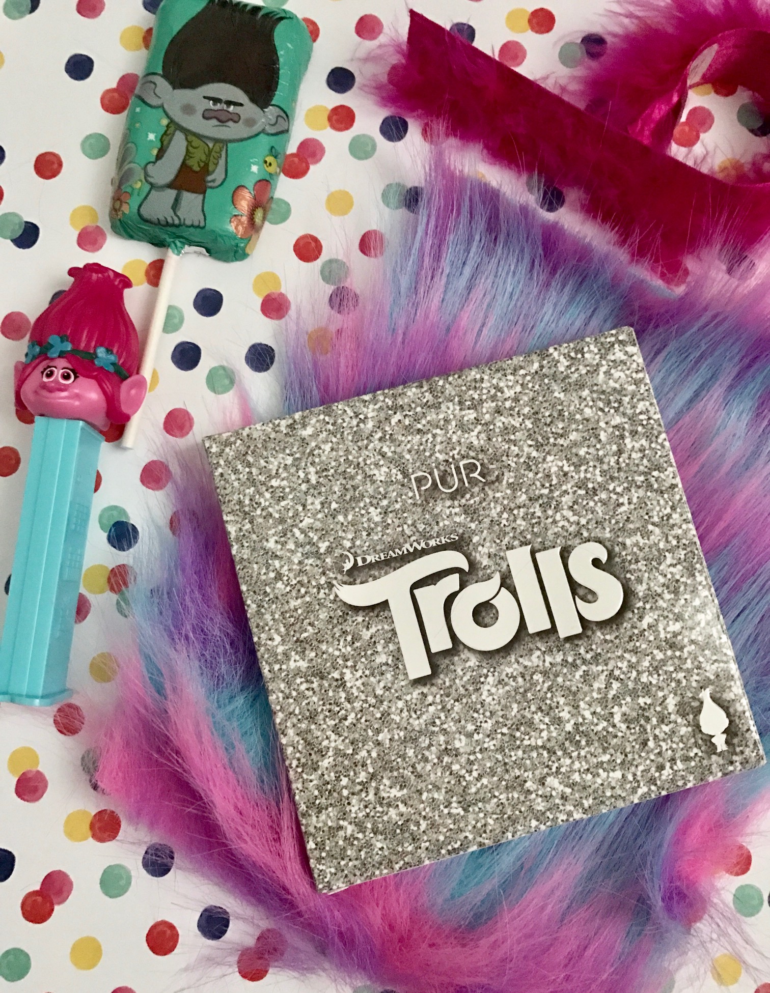 PUR Cosmetics Trolls Shadow Palette in outer packaging wi Poppy Pez dispenser & chocolate lollipop, neversaydiebeauty.com