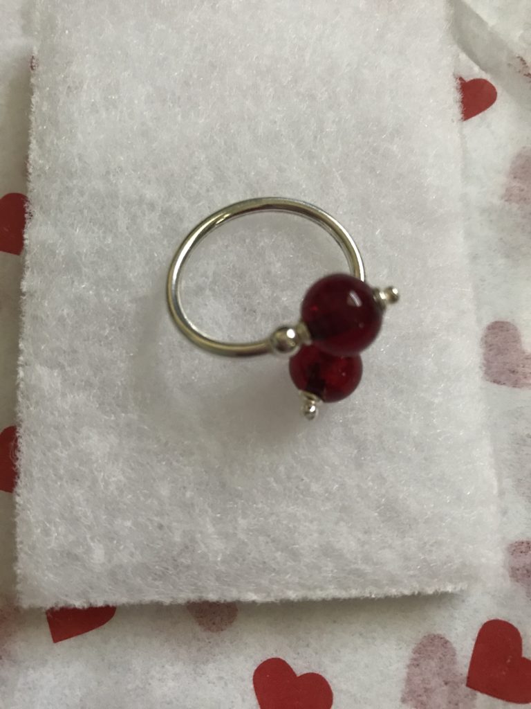 Lorena's Red and Sterling Silver adjustable ring from Uno Alla Volta, neversaydiebeauty.com