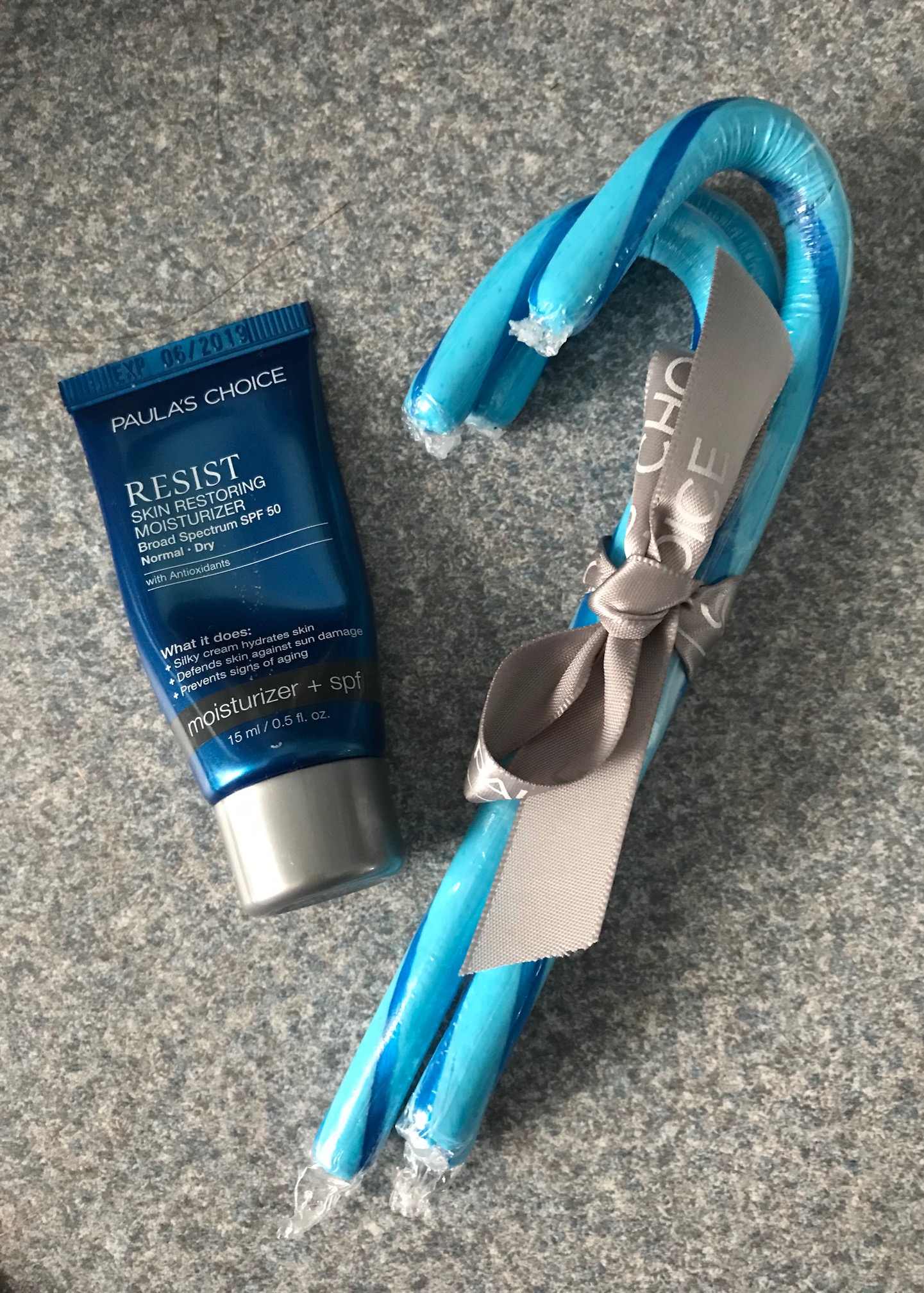 my almost empty travel size tube of Paula's Choice RESIST Skin Recovery Moisturizer SPF 50, neversaydiebeauty.com