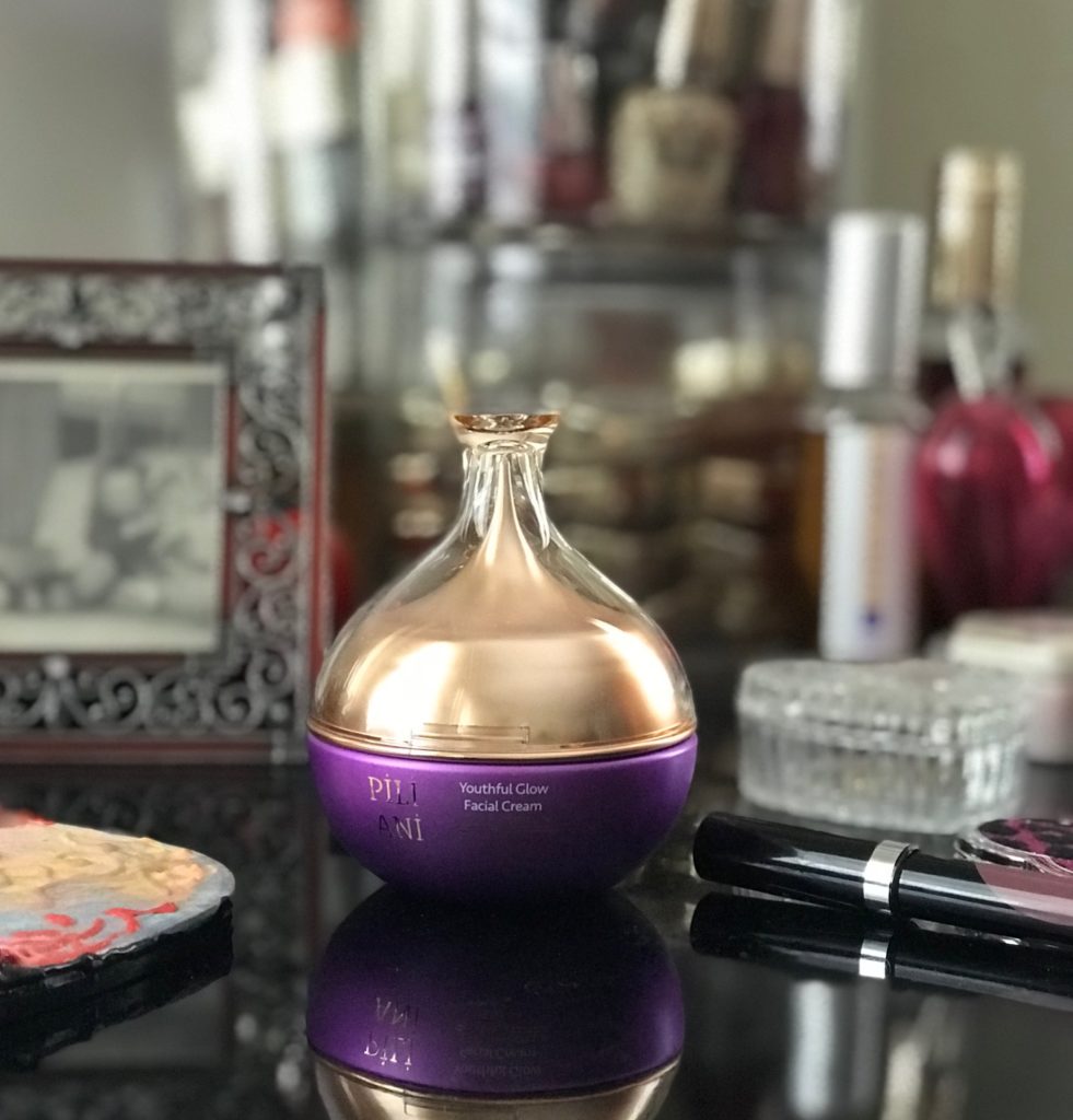 jar of Pili Ani Youthful Glow Facial Cream on my vanity table, neversaydiebeauty.com