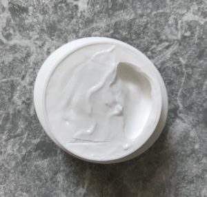 open jar of SebaMed Moisturizing Face Cream to show the white lightweight cream, neversaydiebeauty.com