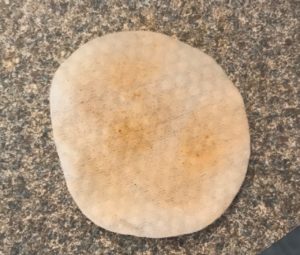 a NIP+FAB Glycolic Fix Daily Cleansing Pad after I used it to remove the remnants of my makeup, neversaydiebeauty.com