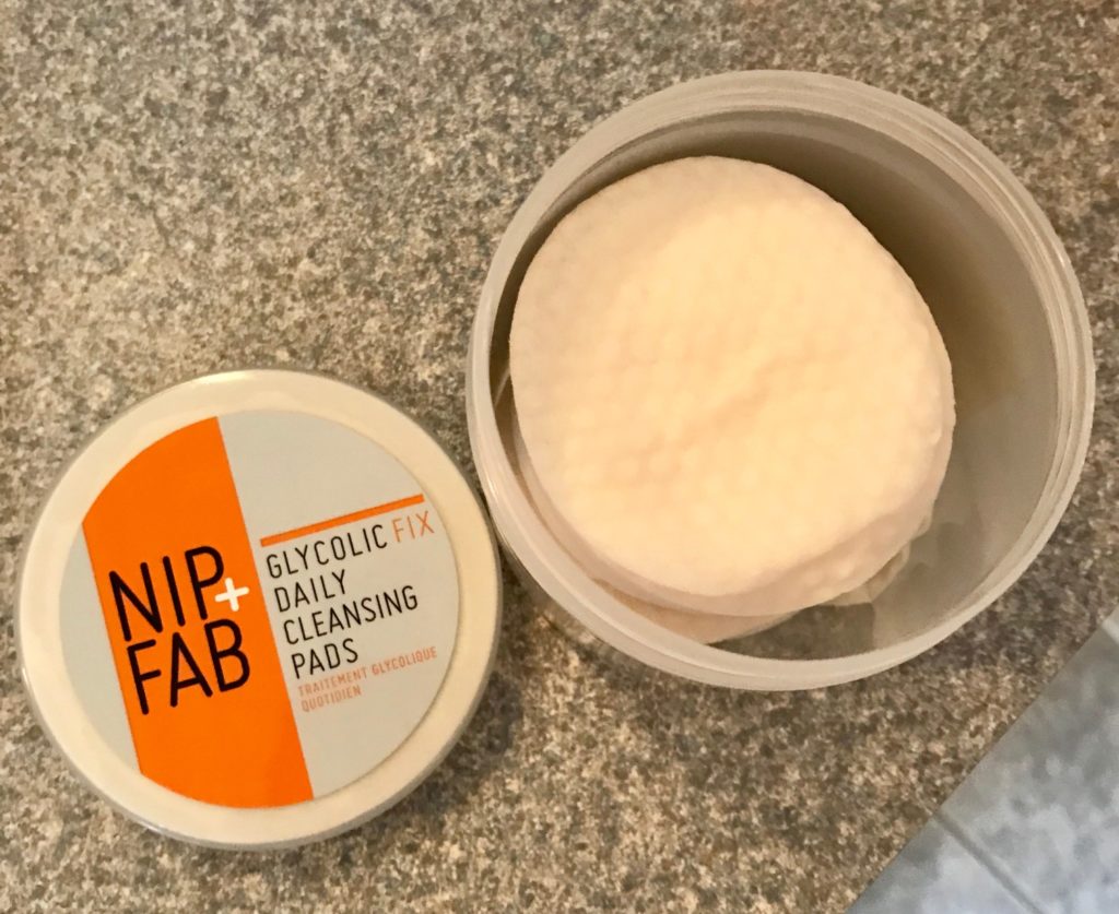 jar of NIP+FAB Glycolic Fix Daily Cleansing Pads open to show the pads inside, neversaydiebeauty.com