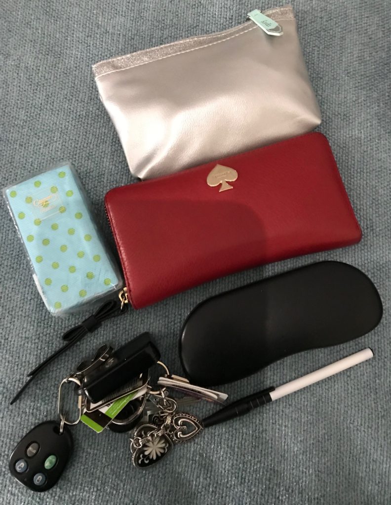 the stuff I keep in my purse: makeup bag, clutch wallet, tissues, glasses, keys, pen, neversaydiebeauty.com