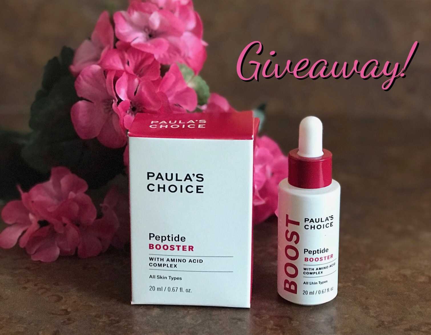 Paula's Choice Peptide Booster bottle and box with giveaway title, neversaydiebeauty.com