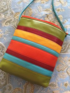 striped leather crossbody in chartreuse, red, orange, aqua, saffron, neversaydiebeauty.com