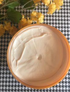 open jar of The Body Shop Vanilla Pumpkin Body Butter to show the thick, creamy, off white body butter inside, neversaydiebeauty.com