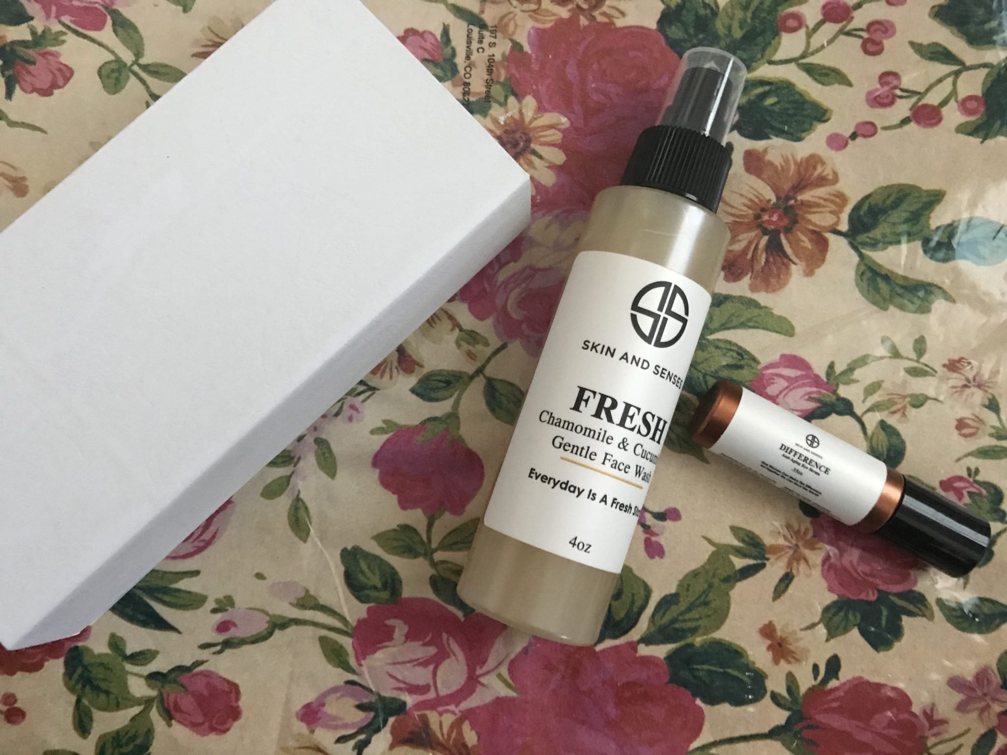 Skin And Sense facial skincare products: Fresh Face Wash, Difference Anti-Aging Eye Serum and face roller in presentation box, neversaydiebeauty.com