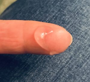 blob of clear gel Paula's Choice Smoothing Primer Serum SPF 30 on my finger to show how light it is