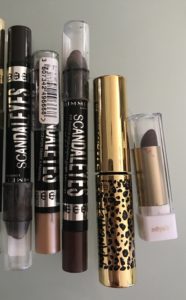 old Rimmel Scandaleyes Crayons, Tarte Man-eater Mascara tube and mini-tube of deep burgundy lipstick