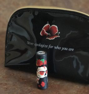 cardboard case showing iconic illustration of Frida Kahlo swearing sugar skull makeup for Day of the Dead
