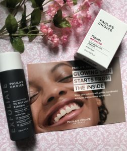 bottle of Paula's Choice 2% BHA Liquid Exfoliant and box of Peptide Booster with product card