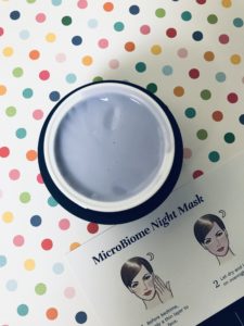 violet colored cream inside the jar of City Beauty MicroBiome Night Mask