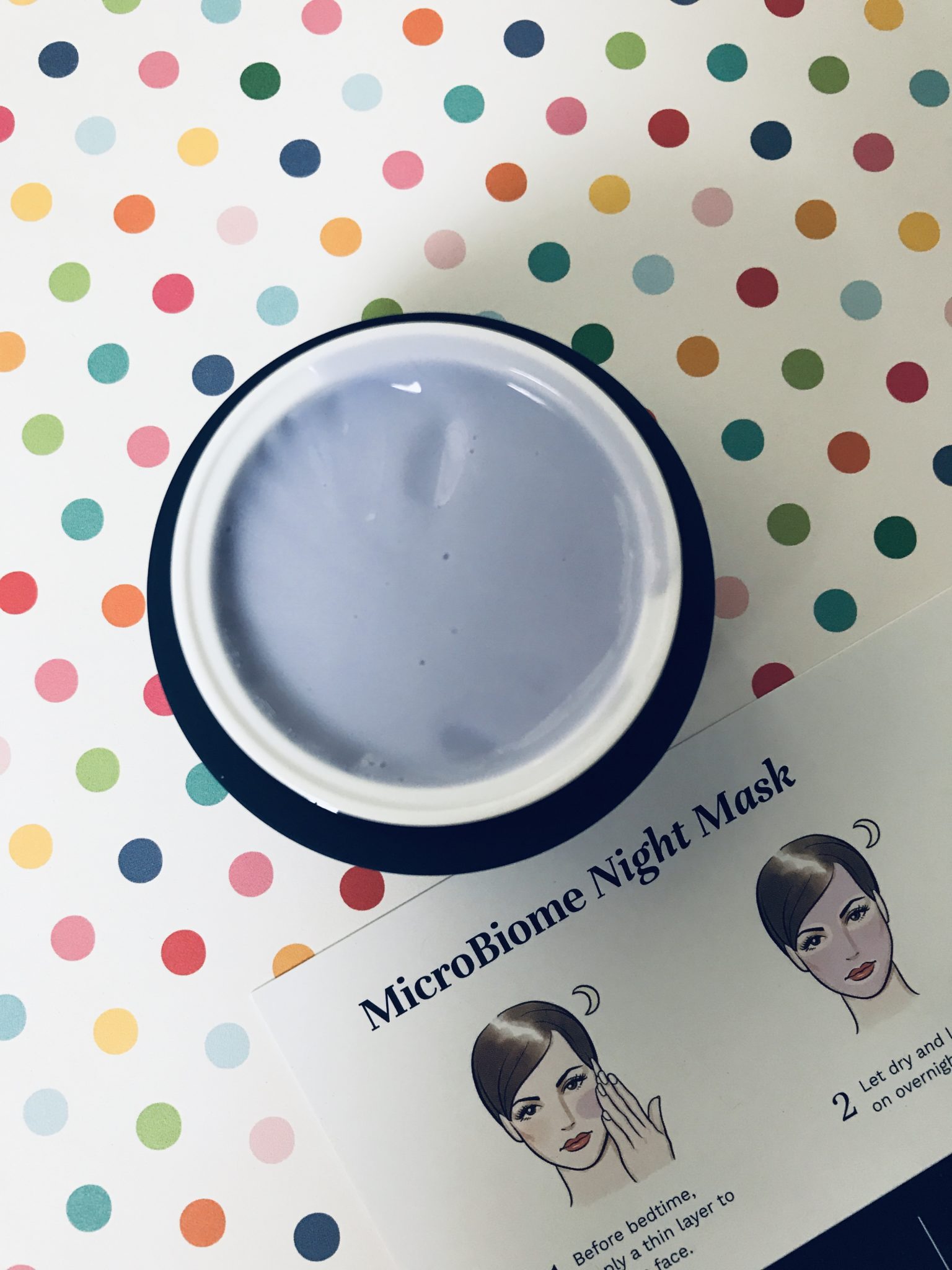violet colored cream inside the jar of City Beauty MicroBiome Night Mask