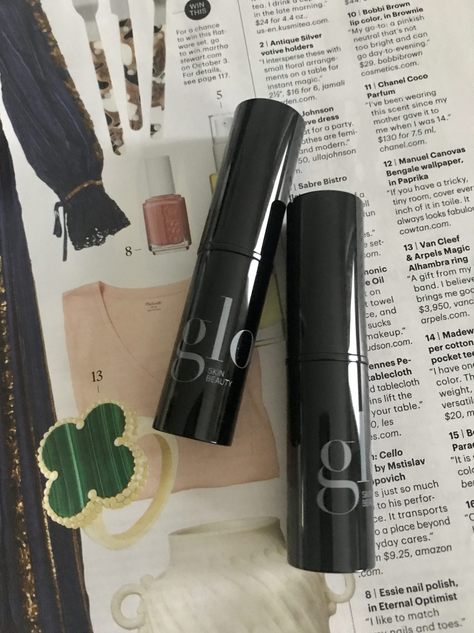 two sticks of Glo HD Mineral Foundation in their black cases