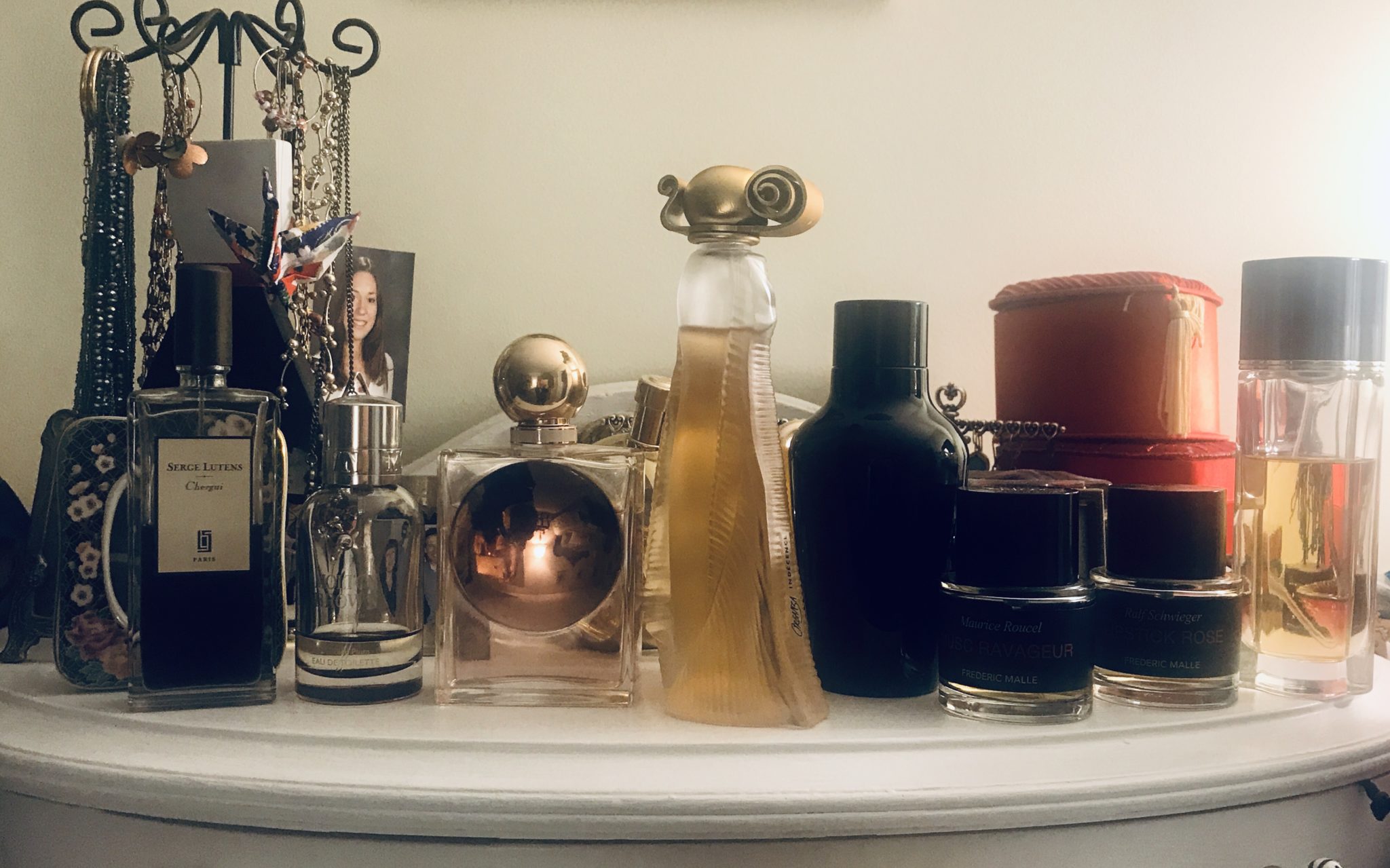 bottles of my perfumes on my dresser
