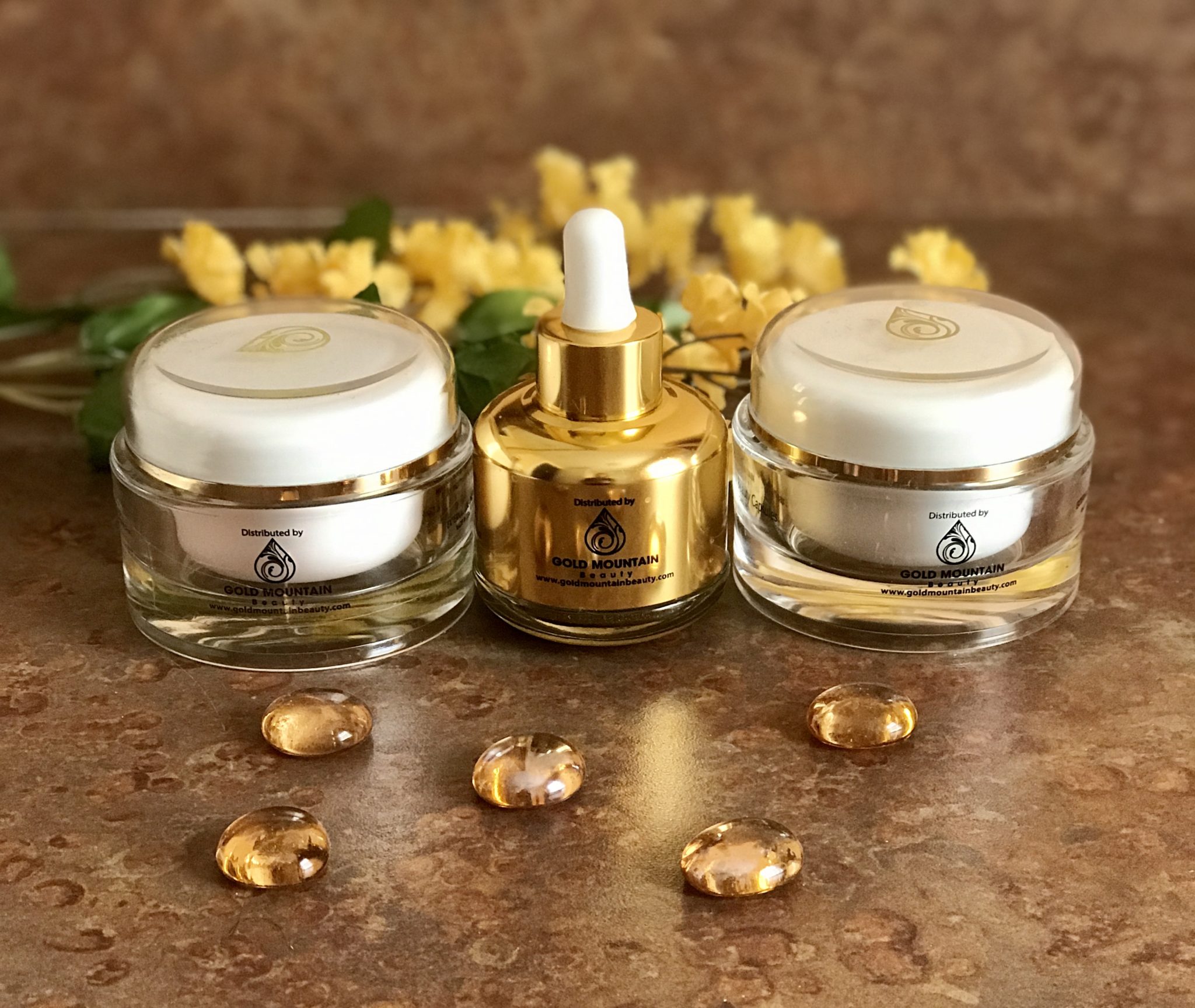 bottle and two jars of skincare products from Gold Mountain Beauty