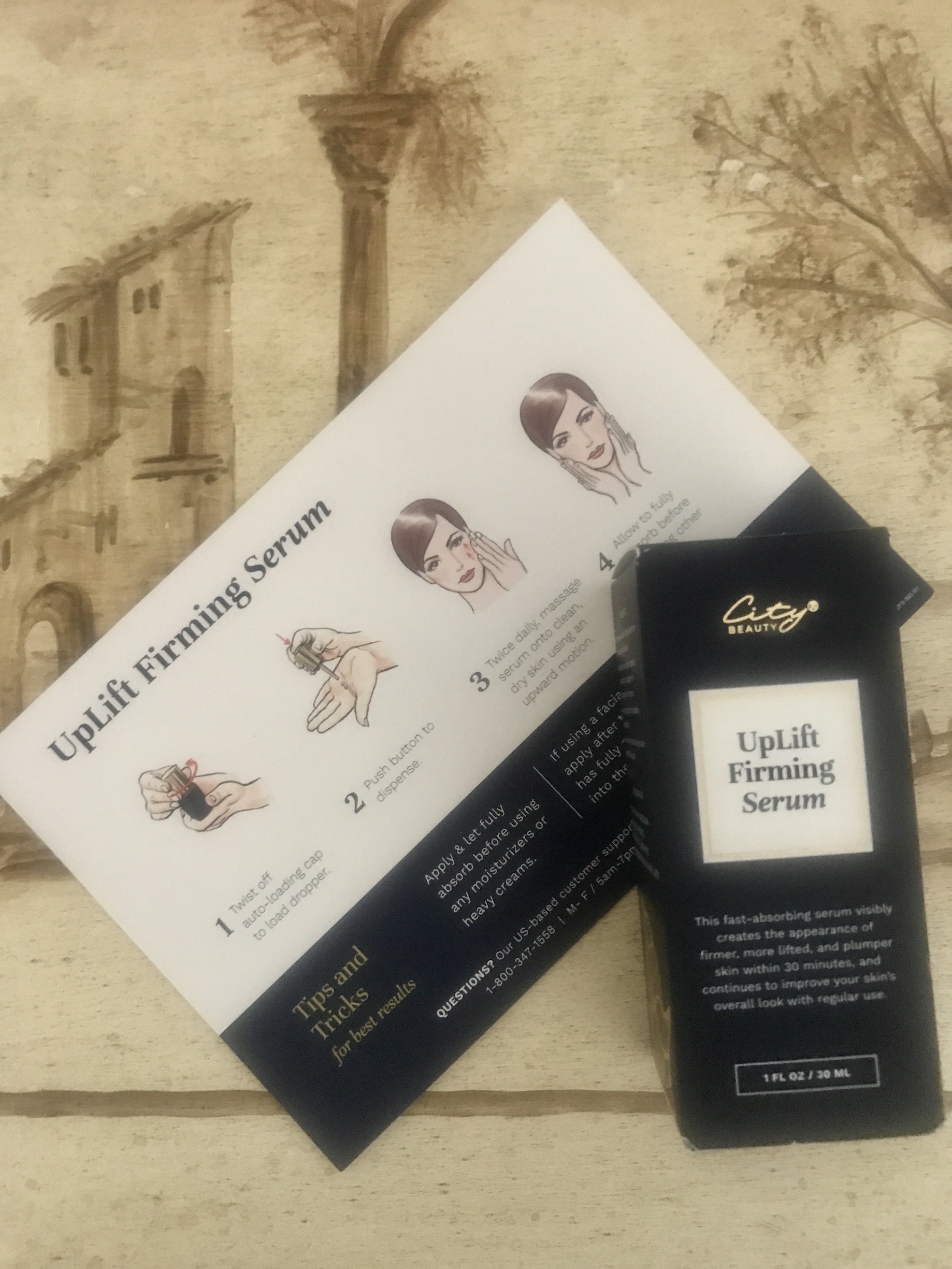 City Beauty UpLift Firming Serum in its outer packaging and product card that explains how to apply it
